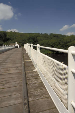Toll bridge over the river wye on the border between wales and england.の写真素材
