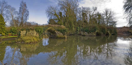 The ruins of the medieval bridge over the river avon at Warwick,の写真素材