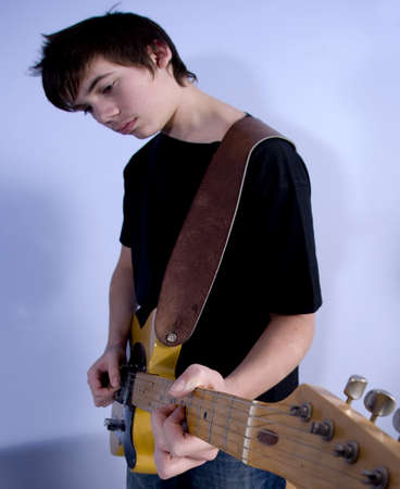 guitarist teenage boy playing guitarの写真素材