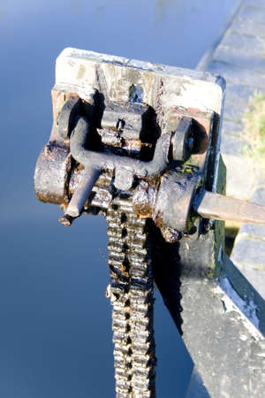 Some gears and cogs on a metal machine.