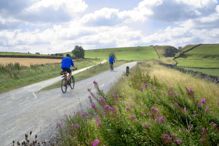 View from the tissington trail cycleway and footpath along disused railway line peak district national park derbyshire england uk.の写真素材
