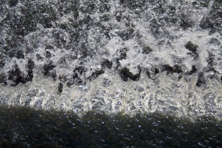 A fall of water, a mill race from a reservoir to a canal.の写真素材