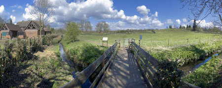footpath over a wooden bridge and stream