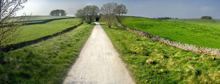 view from the tissington trail cycleway and footpath along disused railway line peak district national park derbyshire england ukの写真素材