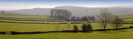 peak district landscape with fields and dry stone wallsの写真素材