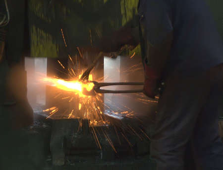 Inside a factory making manufactured goods with steel.