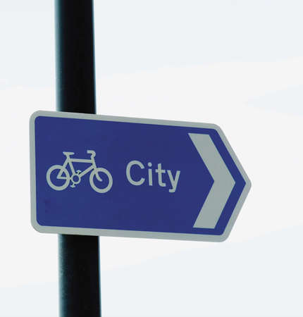 a signpost indicating cycleroute in cityの写真素材