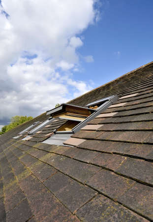 Windows in the roof of a houseの写真素材
