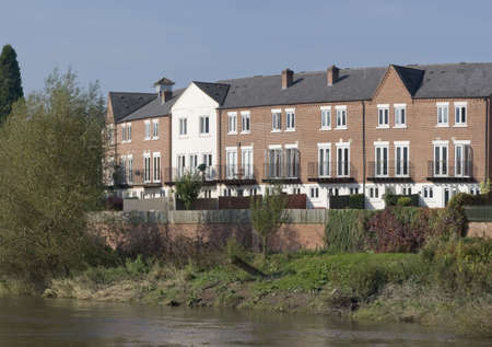flats alongside a riverの写真素材