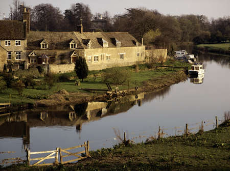 village with houses in countryside wansford cambridgeshire river great ouseの写真素材
