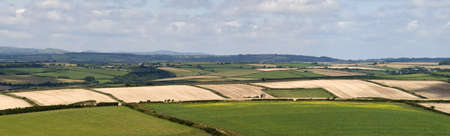 view over devon countryside with fields and farmlandの写真素材