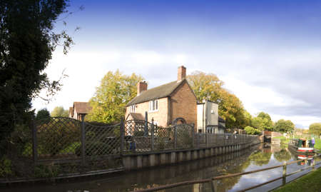 A narrow boat on the Stratford upon avon canal, Preston Bagot flight of locks, Warwickshire, Midlands England UK.の写真素材