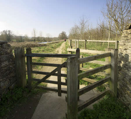 gate and stile on the cotswolds way footpath Lower Slaughter Villageの写真素材