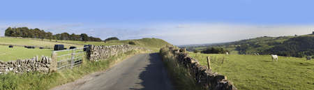 peak district landscape with fields and dry stone walls