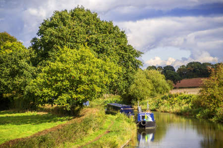 a canal on the inland waterways network of navigable canals and waterways in the english and british countryside in the uk, united kingdom, great britain, europeの写真素材