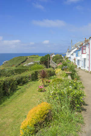 houses by the sea on the cornish coast cornwall, england ukの写真素材