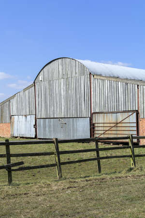barn door on farm buildings made of woodの写真素材