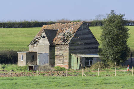 an old ruined barn on a farmの写真素材