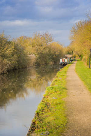 The banks of a river, with bushes and trees. の写真素材