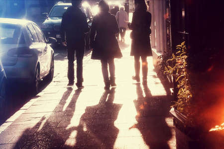 Young people on the pavements of an urban street