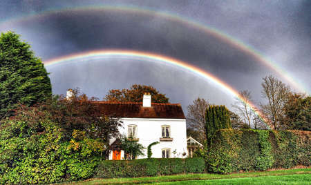 Rainbow over country cottageの素材