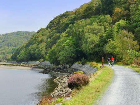 Mawddach cycle and hiking trail between barmouth and Dolgellau along the estuary gwynedd North Wales UKの素材