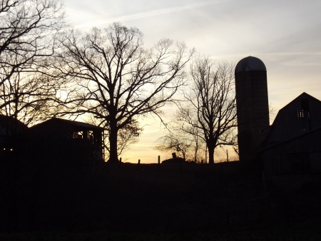 Rural farm silhouette in Mantua Ohio  Image captured in the early morning just as the sun was rising の写真素材