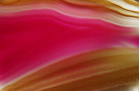 Pink and tan abstract image of polished rock の写真素材