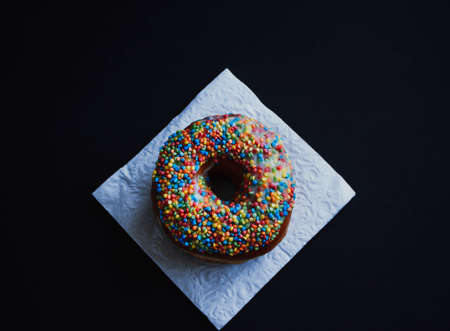 Close view at tasty donuts on a dark background