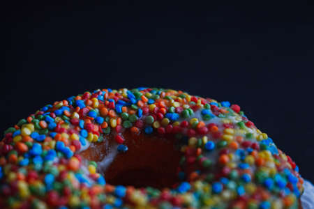 Close view at tasty donuts on a dark backgroundの写真素材
