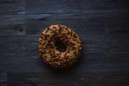 Whole grain cereal shortbread biscuits cookies stacked with nuts. Wooden backgroundの写真素材