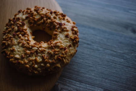 Whole grain cereal shortbread biscuits cookies stacked with nuts. Wooden backgroundの写真素材