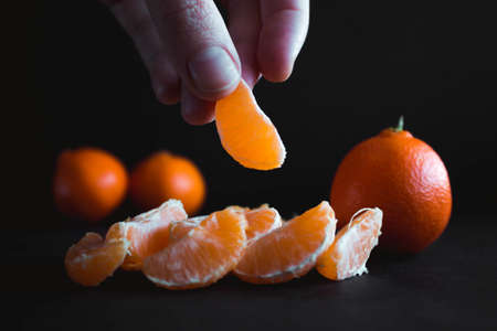 Mandarin (Tangerin) on a dark backgroundの写真素材