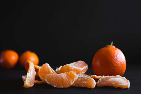 Mandarin (Tangerin) on a dark backgroundの写真素材