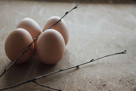 Four chicken organic eggs on rustic wooden background. Spring raw fresh style.の写真素材