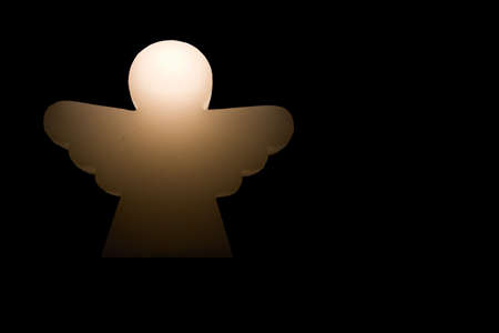 Glowing angel in the deep night.の写真素材