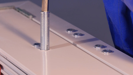 Installation Accessories For Plastic Pvc Windows. Screwdrivers or Drill. Male Hands Fasten Window Handle By Electric Screwdriver. Tempered float glass panels. Industryの写真素材