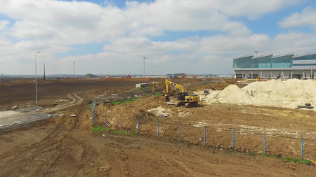The construction of the airport with runway. Aerial view of Airport runway become a construction site. workers build the new airport and special equipment. Airport construction and Sky with Cloudsの写真素材