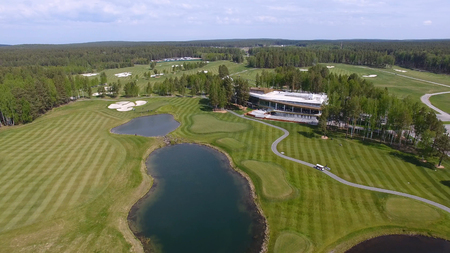 Golf course on a Sunny day, an excellent Golf club with ponds and green grass, view from the skyの写真素材