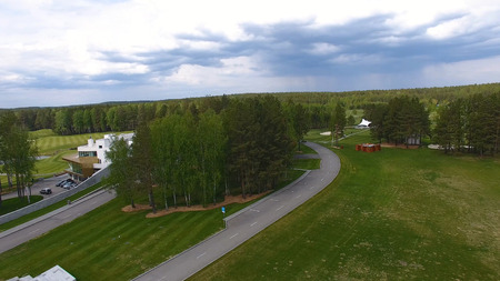 Solar Golf cart with clouds on blue sky and forest lake Golf club, aerial.の写真素材