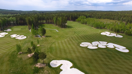 Top view green golf course outdoor green grass field. Aerial view from flying drone.の写真素材