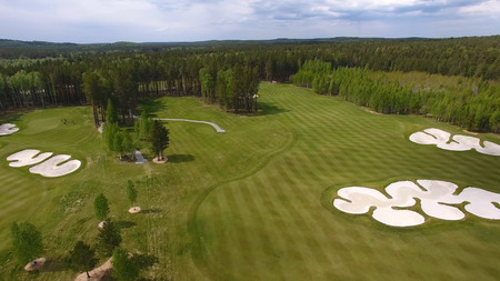 Top view green golf course outdoor green grass field. Aerial view from flying drone.の写真素材