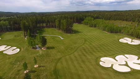 Top view green golf course outdoor green grass field. Aerial view from flying drone.の写真素材