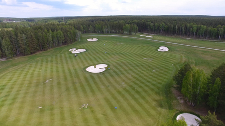 Top view green golf course outdoor green grass field. Aerial view from flying drone.の写真素材