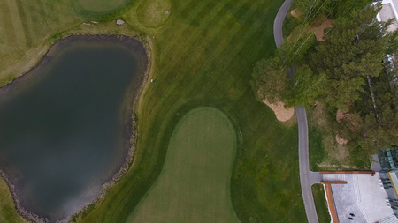 Top view green golf course outdoor green grass field. Aerial view from flying drone.の写真素材