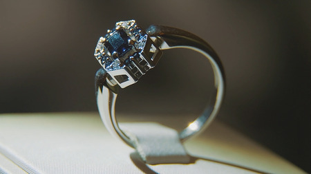 Precious diamond rings. Fine luxury diamond jewellery window display with ring pedant. Gold ring with brilliant isolated on black backgroundの写真素材