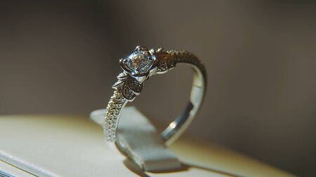 Precious diamond rings. Fine luxury diamond jewellery window display with ring pedant. Gold ring...