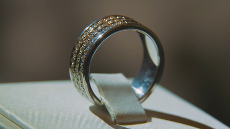 Precious diamond rings. Fine luxury diamond jewellery window display with ring pedant. Gold ring...
