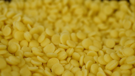Yellow pills for dessert. Yellow dragees for cake, closeup.の写真素材