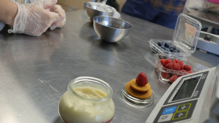 Table for making cake with raspberry cream weights.の写真素材